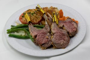 Plate of lamb chops with green beans and carrots